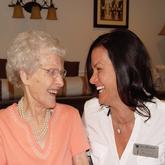 Resident and administrator laughing Resident and administrator laughing